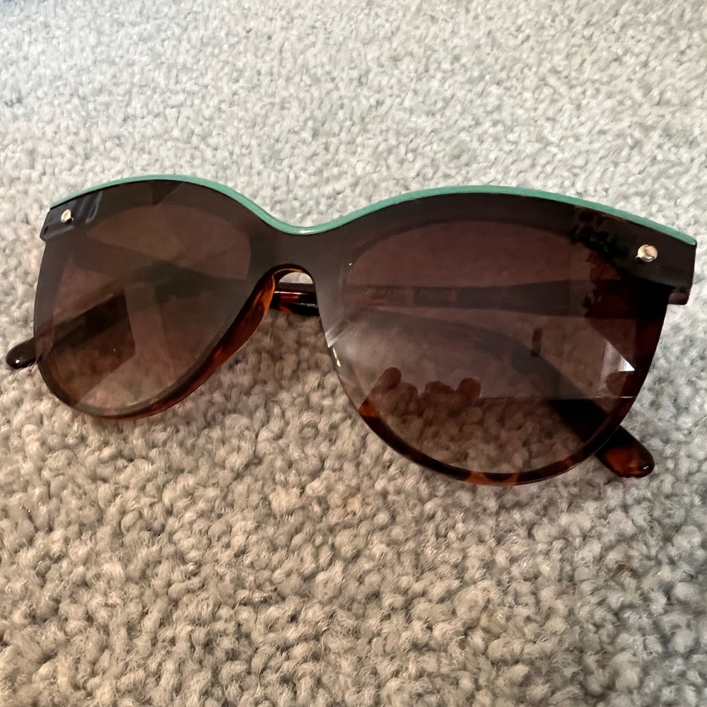 Sunglasses with blue lining over top